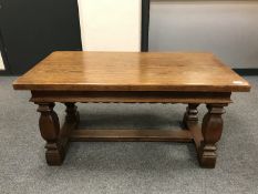 An oak arts and crafts style low table, width 110 cm.