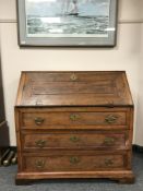 A nineteenth century continental oak bureau, width 105 cm.