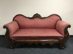 A 19th century Empire style scroll arm settee,