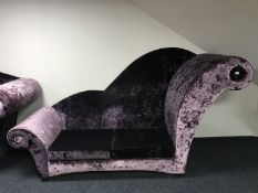 A contemporary over-sized chaise longue upholstered in purple fabric, height 155 cm.