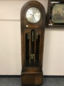 An early twentieth century oak regulator clock with silvered dial