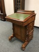 A Victorian walnut davenport, width 54 cm.