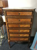 An early 20th century inlaid mahogany and ormolu mounted narrow six drawer chest,
