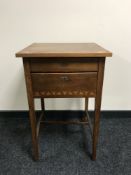An early 20th century inlaid mahogany bedside table fitted with two drawers,