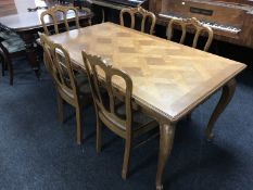 A French oak country dining table 90.5 cm x 160.5 cm, together with six matching chairs.