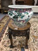 A Chinese hardwood plant pedestal inset with rouge marble, height 45 cm, diameter 40 cm,