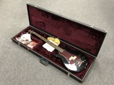 A Westbury electric bass guitar in carry case.