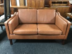 A mid 20th century continental brown leather two seater settee,