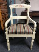 A 19th century painted open armchair, with striped fabric cushion,