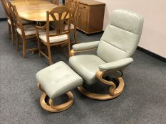A green leather Himolla relaxer chair and stool.