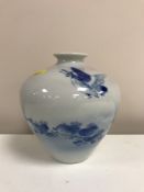 A Chinese porcelain blue and white ovoid vase, depicting a bird catching a fish,