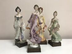 A set of four limited edition Albany fine china Art Nouveau series figures depicting ladies in