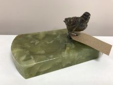 An early 20th century onyx ashtray surmounted by a cold painted bronze figure of a snipe.