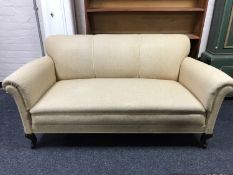 A late 19th century three seater settee, upholstered in cord fabric,