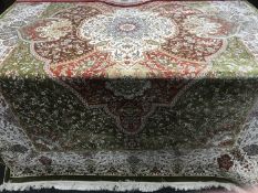 A very fine, modern Isfahan design carpet on green ground, 300 cm x 200 cm.