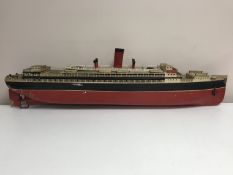 An early twentieth century tin plated clock-work ocean liner by Bing, length 102 cm.