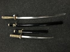 Two Samurai-style swords, in scabbards.