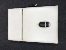 A folding portable massage table