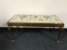 A mahogany tapestry upholstered duet stool