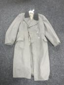 A grey woollen 3/4 length military style overcoat