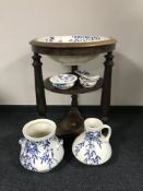 An antique circular mahogany wash stand inset blue and white floral basin and a matching five piece