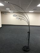 A chrome and marble based five branch floor lamp