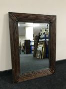 A wicker framed mirror