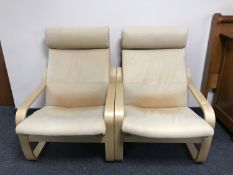 A pair of Ikea beech framed tan leather armchairs