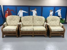 A three piece wicker conservatory suite