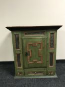 A 19th century painted pine storage cabinet, fitted with three drawers,