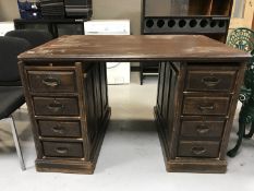 An early 20th century oak twin pedestal desk