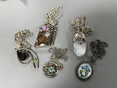 Five silver pendants and chains (5)