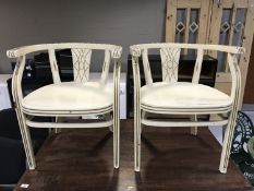 A pair of continental painted armchairs, width 57 cm.