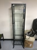 A metal and glass display cabinet