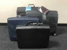 Three Samsonite hard cases with keys and a Delsey briefcase