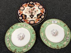 A pair of 19th century gilded cabinet plates, puce marks to base and numbered 1154, diameter 23 cm,