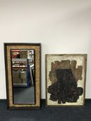 A textured oil mounted on board and an illuminated mirror in cabinet