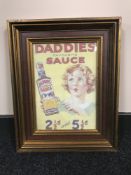 A framed Daddie's Famous Sauce advertisement