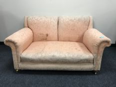 An early twentieth century drop-end settee