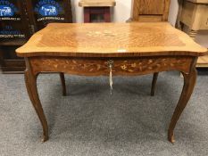 A continental inlaid walnut table,