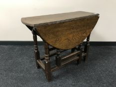 An early 20th century oak gate leg table