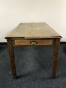 A mid 20th century oak school table fitted a drawer