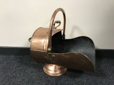 An antique copper coal helmet
