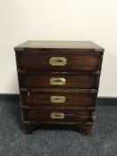 A military style mahogany four drawer chest, with brass handles,