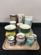 A tray of twelve Nixon & Bolam St Anthony pottery vases and a salt seller