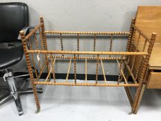 A mid twentieth century bamboo framed child's cot, length 94 cm.