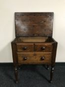 An antique oak sewing table fitted a drawer