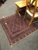 A tribal Gazak rug on red blue ground, 116 cm x 111 cm.