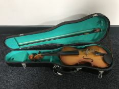 A child's violin with shaped case and bow