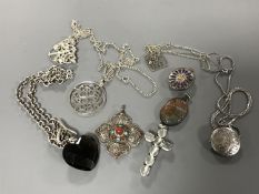 Nine silver pendants and chains (9)